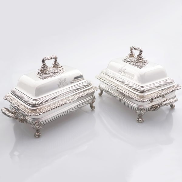 A pair of George III sterling silver entrée dishes and covers with stands, Paul Storr, London, 1817