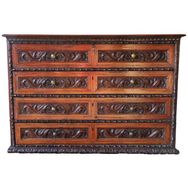 An Italian carved walnut wood chest of drawers with four drawers, Lombardy, 17th century
