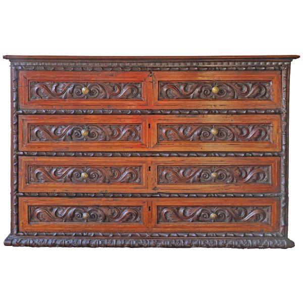 An Italian carved walnut wood chest of drawers with four drawers, Lombardy, 17th century