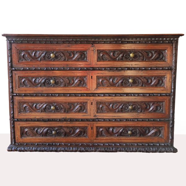An Italian carved walnut wood chest of drawers with four drawers, Lombardy, 17th century