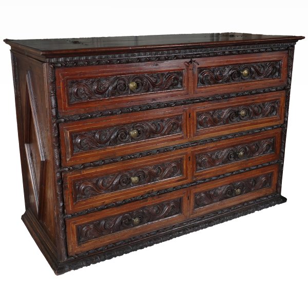 An Italian carved walnut wood chest of drawers with four drawers, Lombardy, 17th century