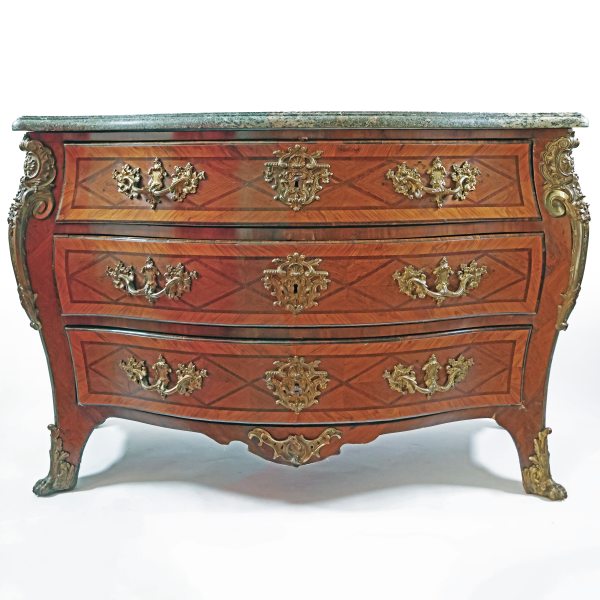 A Louis XV chest of drawers, inlaid with various woods, gilt-bronze mounts. France, mid-18th century
