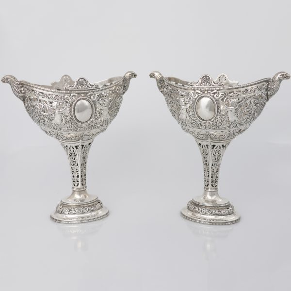 A German pair of silver openwork, embossed and chiseled cups, Hanau, late 19th century
