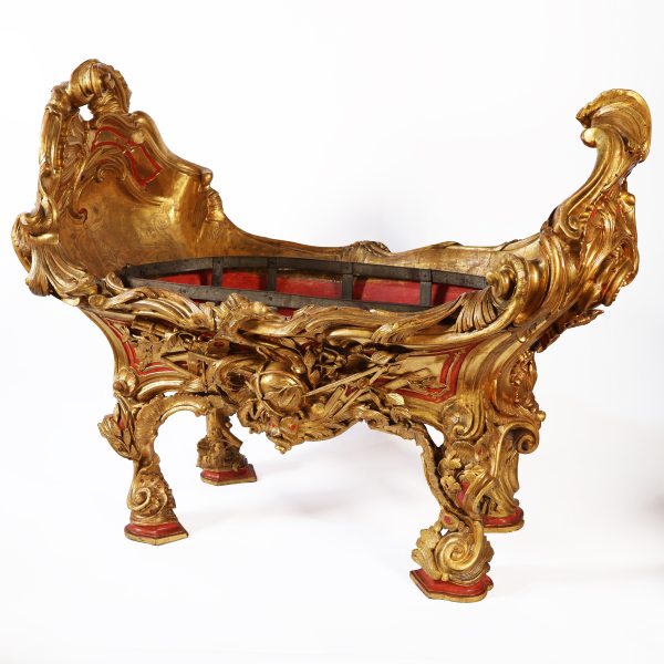 A North Italian carved and gilded wood cradle. Widmann family. Venice, mid-18th century