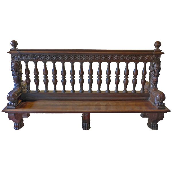 An Italian double bench in carved and sculpted walnut, Tuscany, late 16th early 17th century