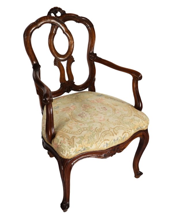 A North Italian set of four armchairs in carved walnut wood. Venice, 18th century
