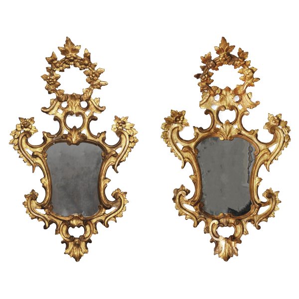 A North Italian pair of carved and giltwood mirrors. Veneto, 18th century
