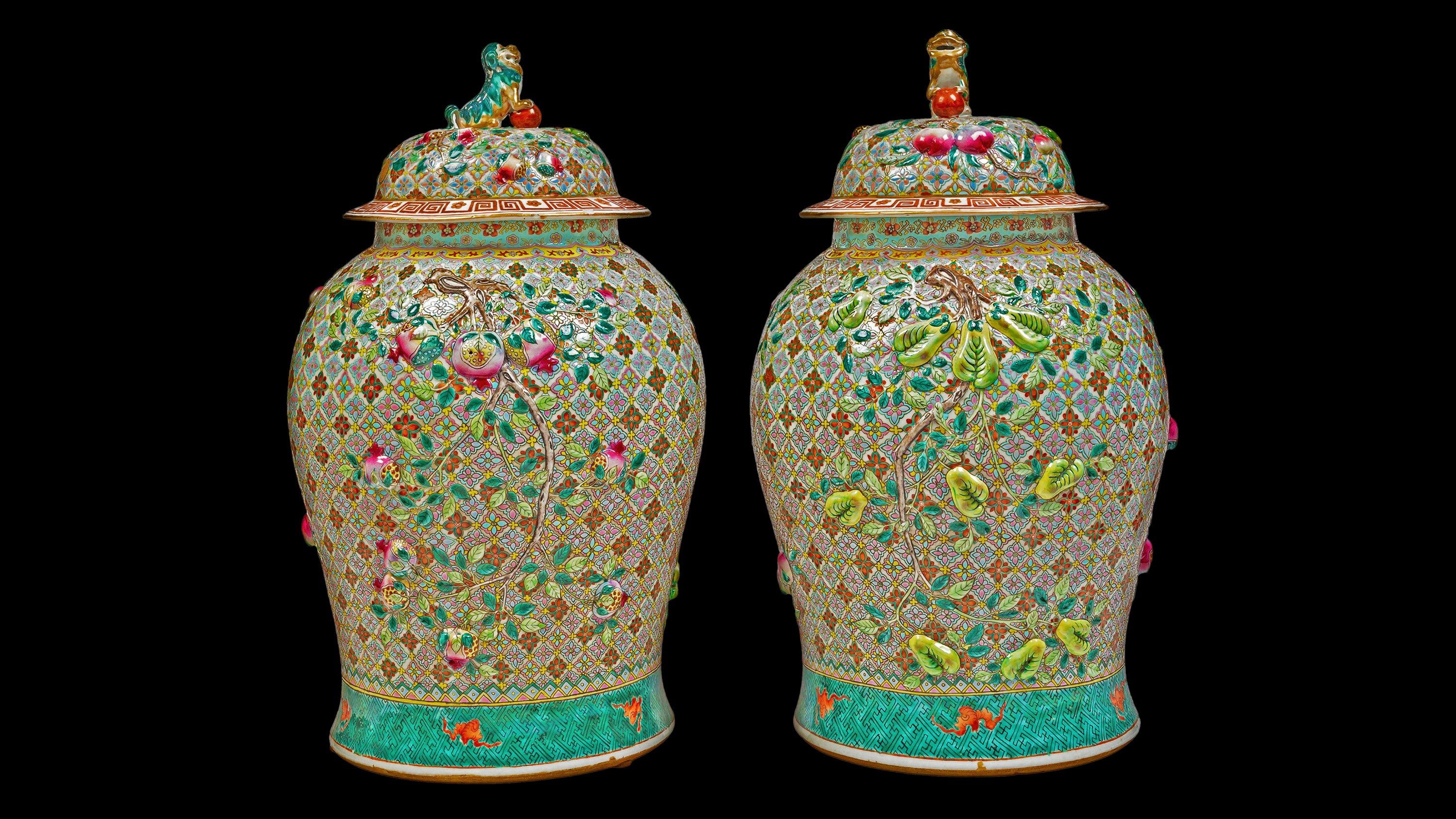 A pair of porcelain vases with moulded decoration on a honeycomb ground and floral motifs. China, Qing Dynasty 1644-1911, 19th century